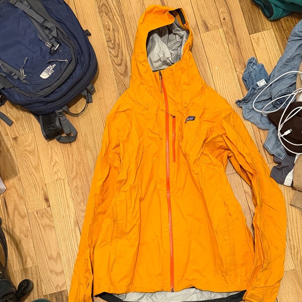 Bright Orange Patagonia Rain Jacket with water roll off tech (2021)